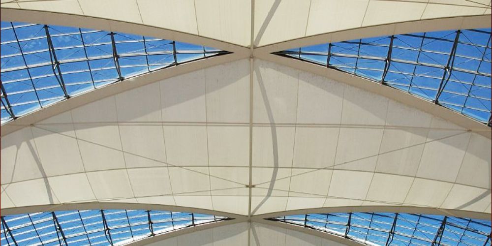 Which is more environmentally friendly: a tensile membrane structure or an inflatable membrane structure?
